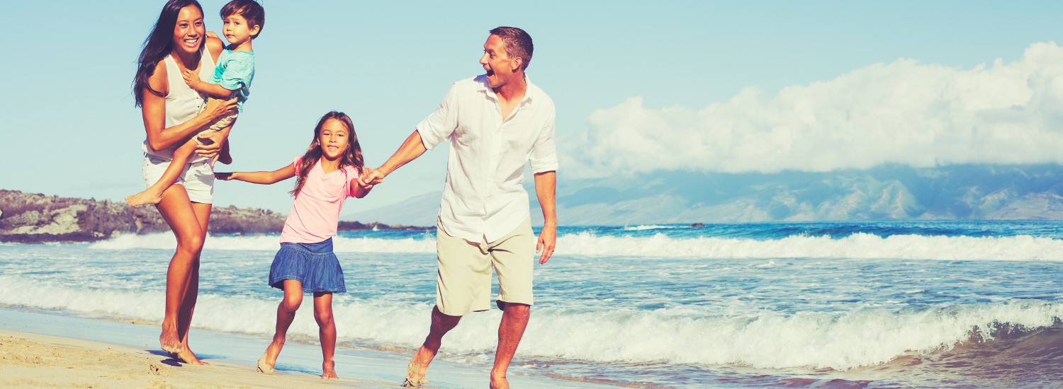 Photo of a family at the beach.