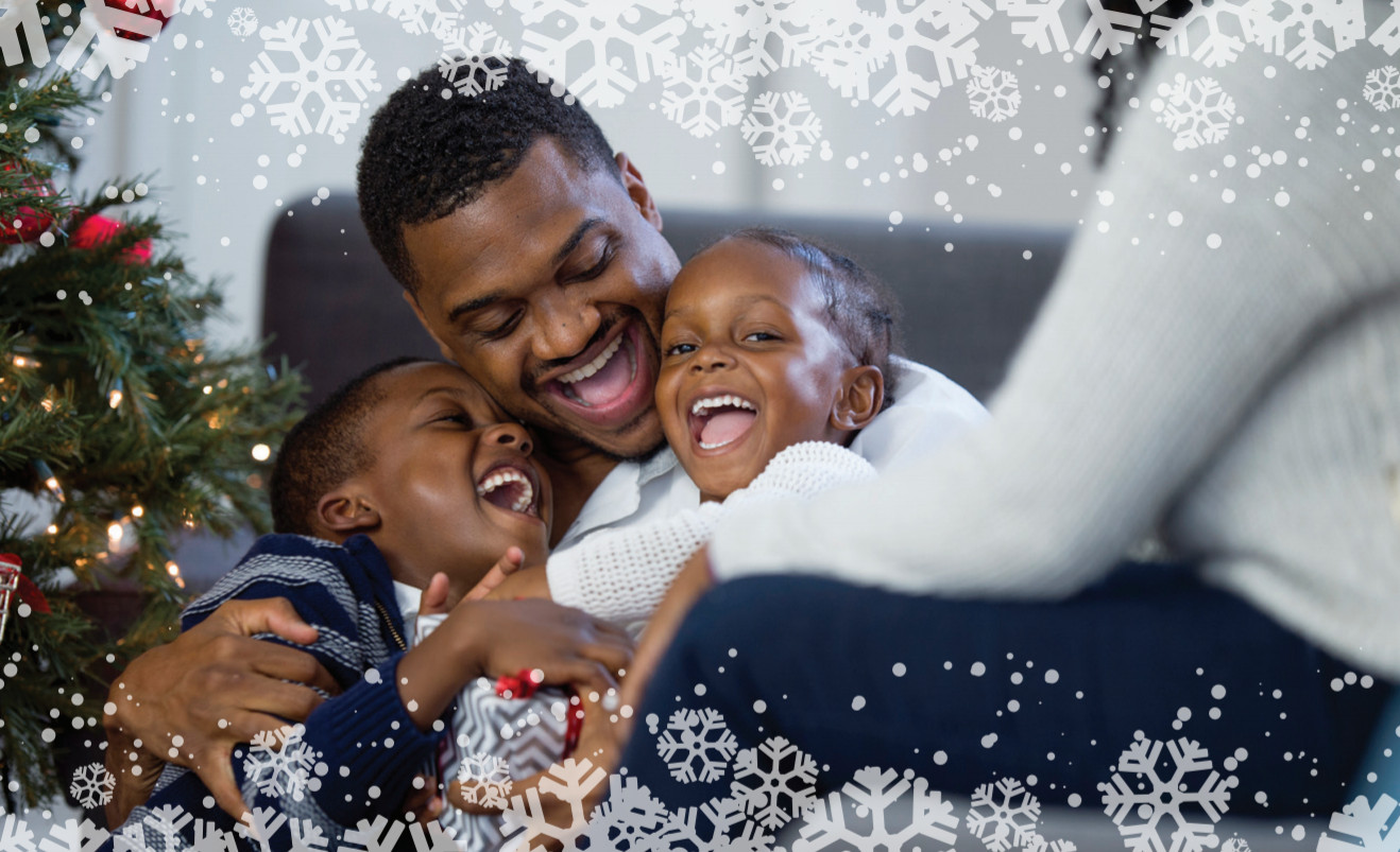 A family with two kids having fun with their dad