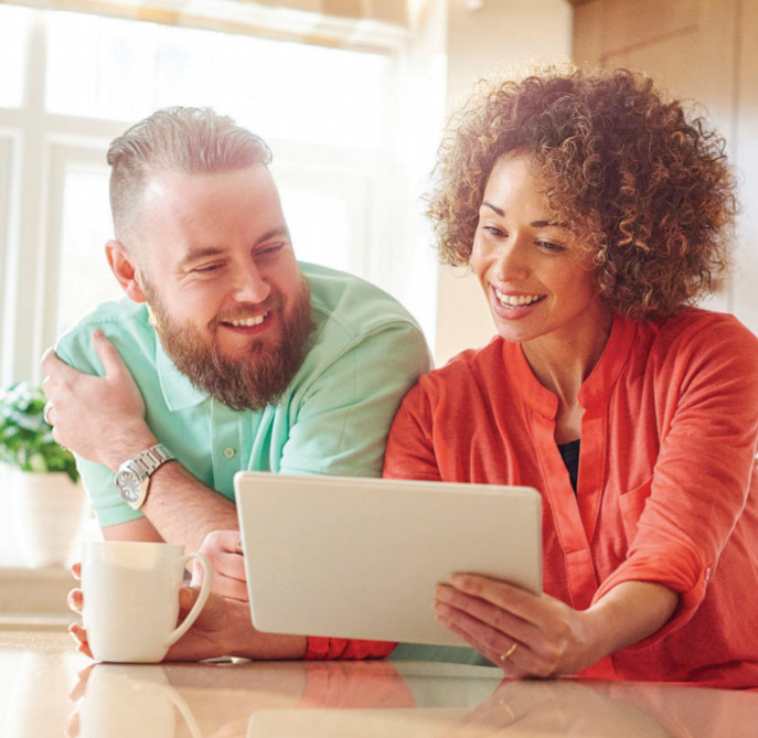 Photo of young couple getting their finances in order