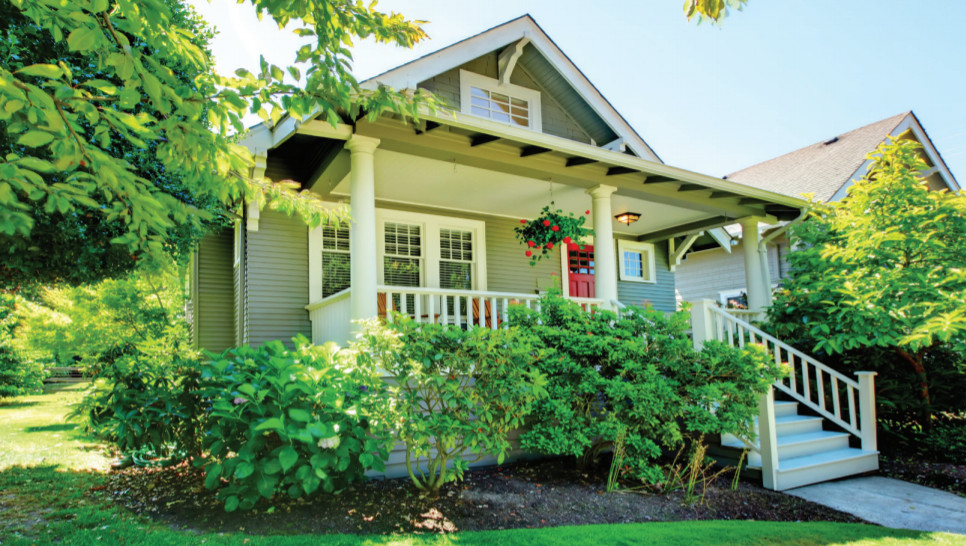 Photo of a home with stairs leading up to a porch