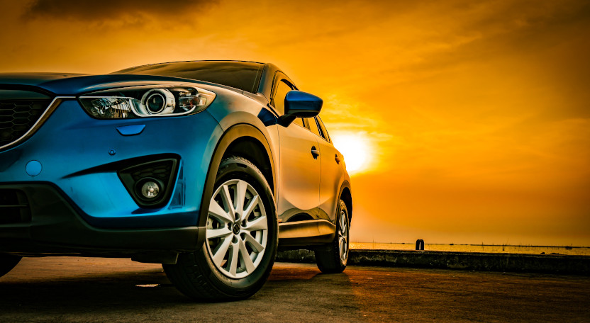 Photo of a car at sunset.